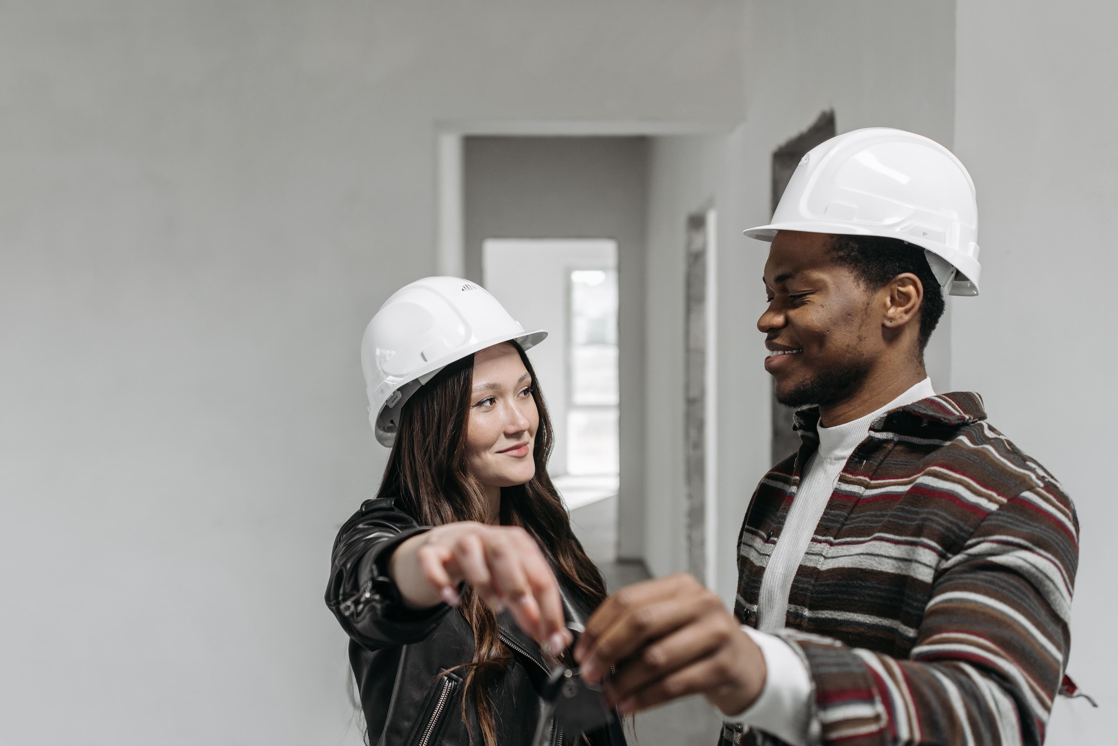 Shengli team member handing over keys to a client on site
