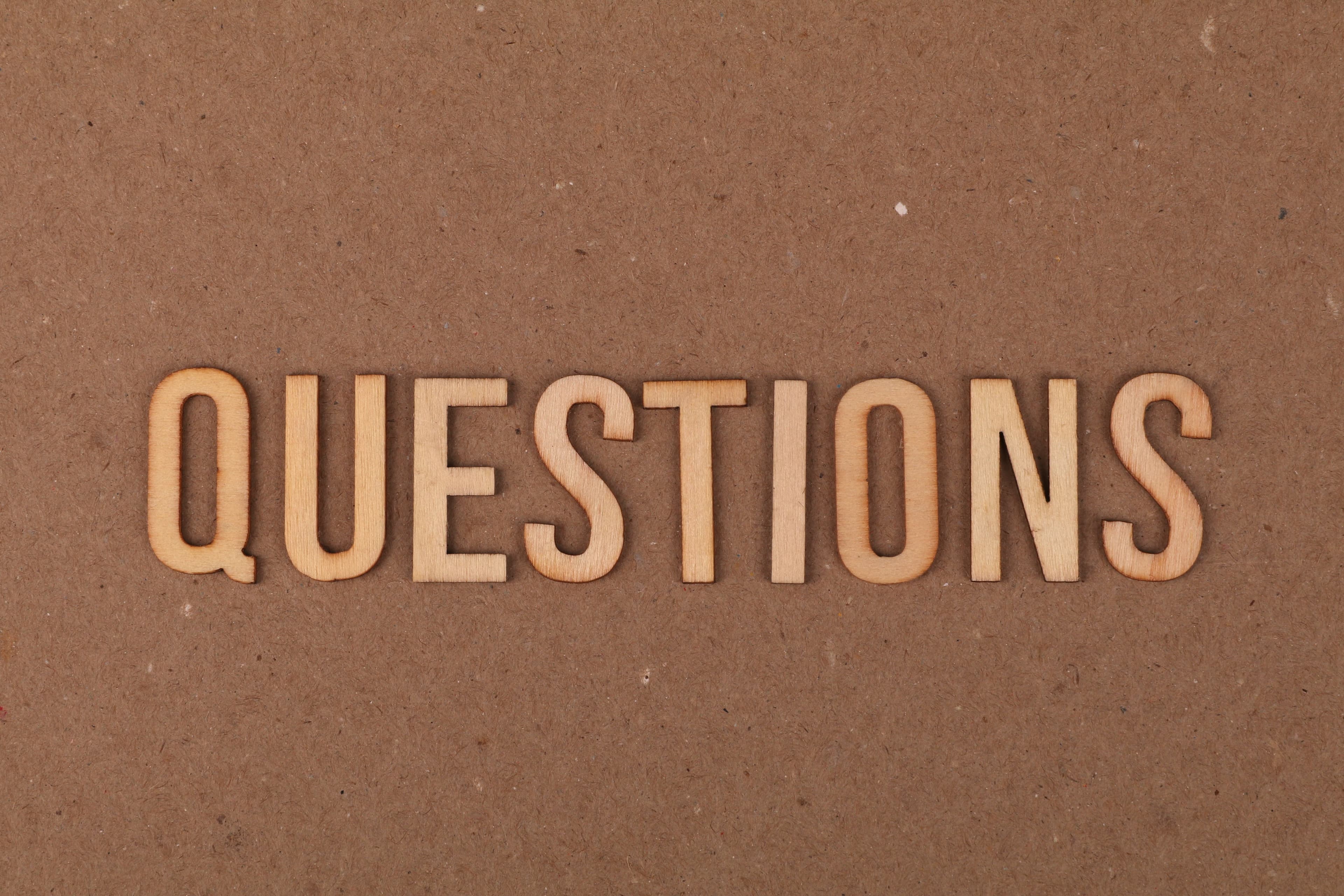 Wooden letters spelling out Questions
